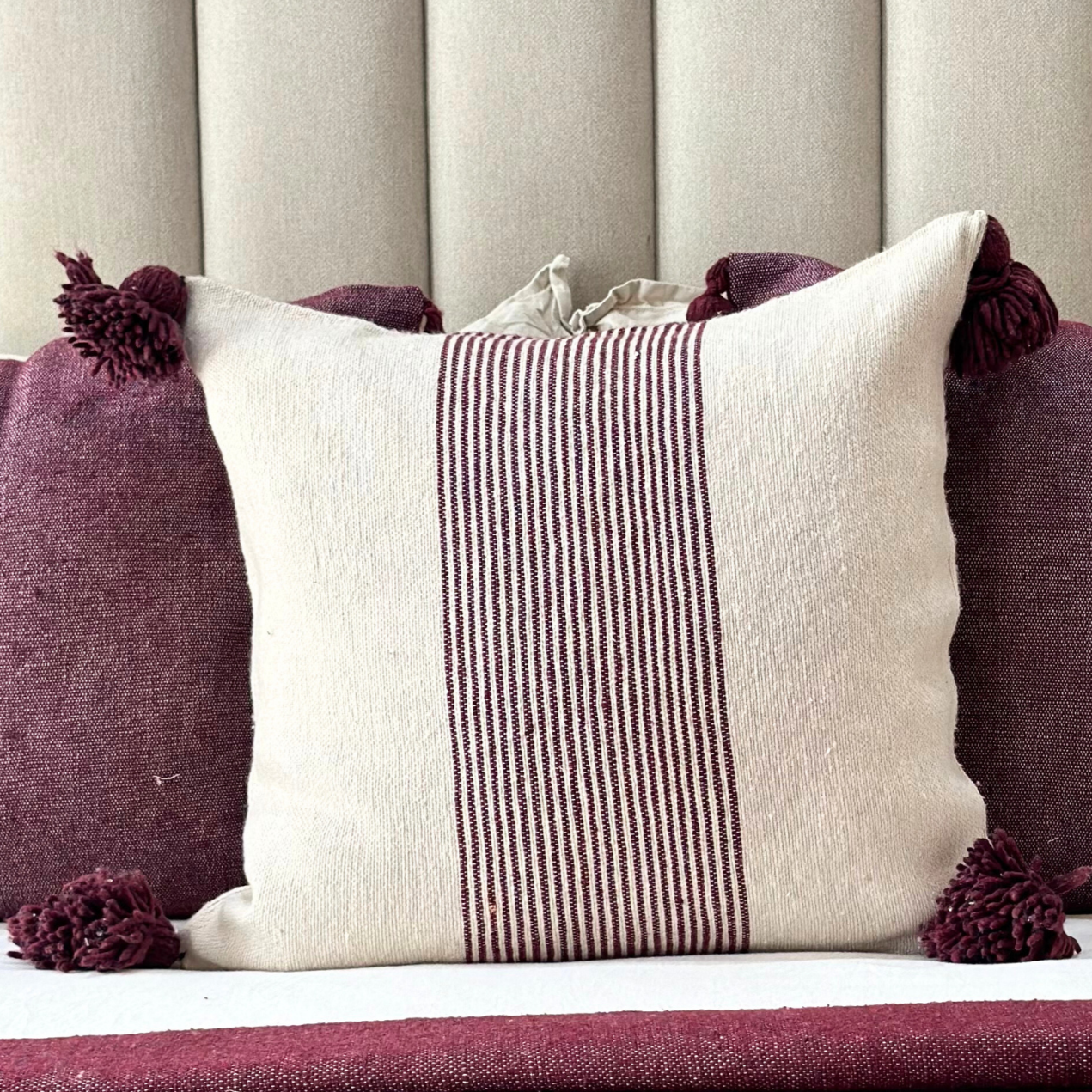 Purple striped pompom cushion cover